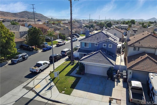 birds eye view of property with a mountain view