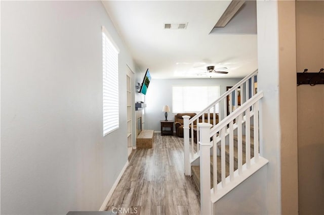 hall with light hardwood / wood-style floors