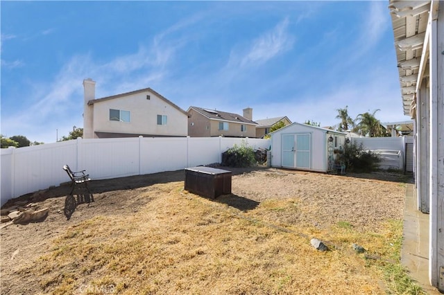 view of yard with a storage unit