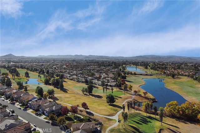 drone / aerial view featuring a water and mountain view