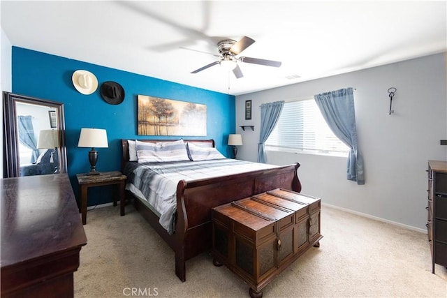 bedroom with ceiling fan and light colored carpet