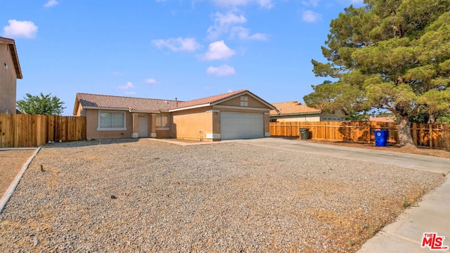 ranch-style home with a garage