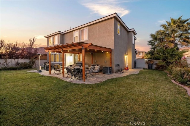 back house at dusk featuring central AC unit, a pergola, a patio area, and a yard