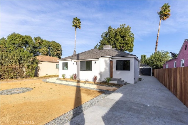 view of front of home featuring an outdoor structure and a garage