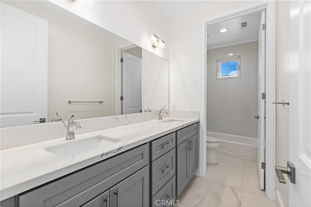 bathroom featuring vanity and toilet