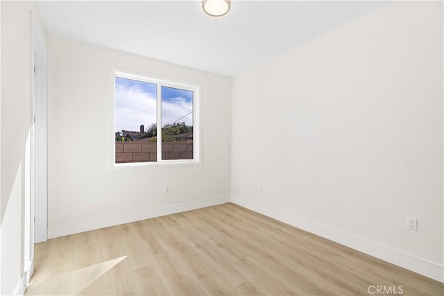 spare room featuring light wood-type flooring