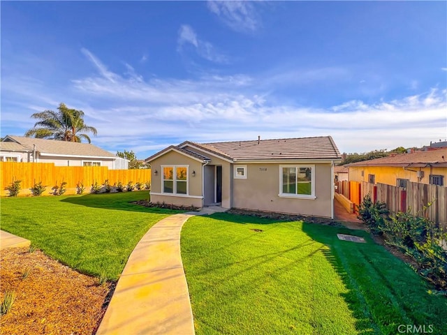 single story home with a front yard