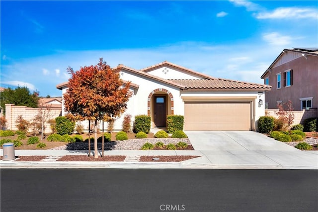 mediterranean / spanish-style home with a garage