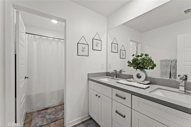 bathroom with vanity and shower / bath combo