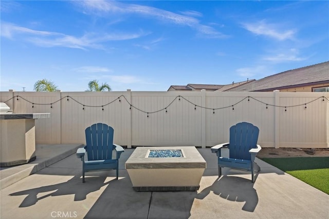 view of patio with an outdoor fire pit