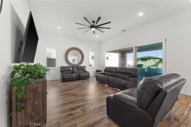 living room with ceiling fan and dark hardwood / wood-style floors