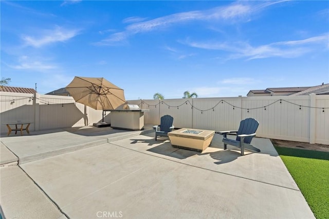 view of patio / terrace with a fire pit