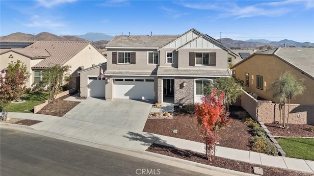 view of front of property with a mountain view and a garage