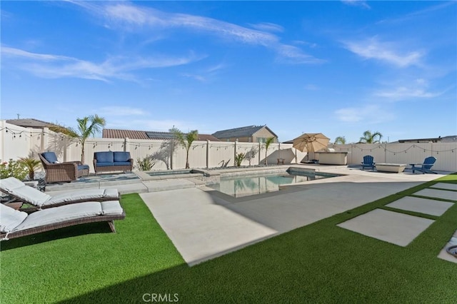 view of swimming pool with a yard, outdoor lounge area, and a patio area