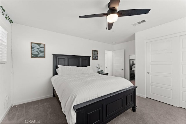 bedroom featuring dark carpet and ceiling fan