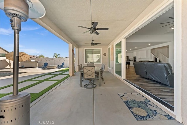 view of patio featuring ceiling fan