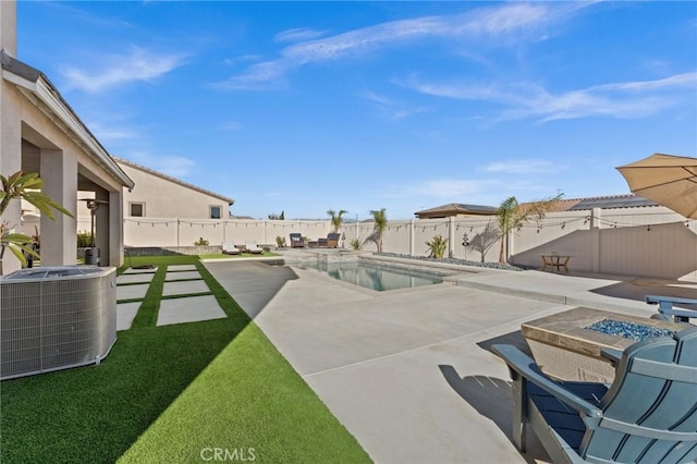 view of swimming pool with an outdoor fire pit, a patio area, and central AC unit