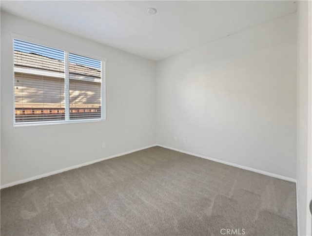 empty room with carpet flooring