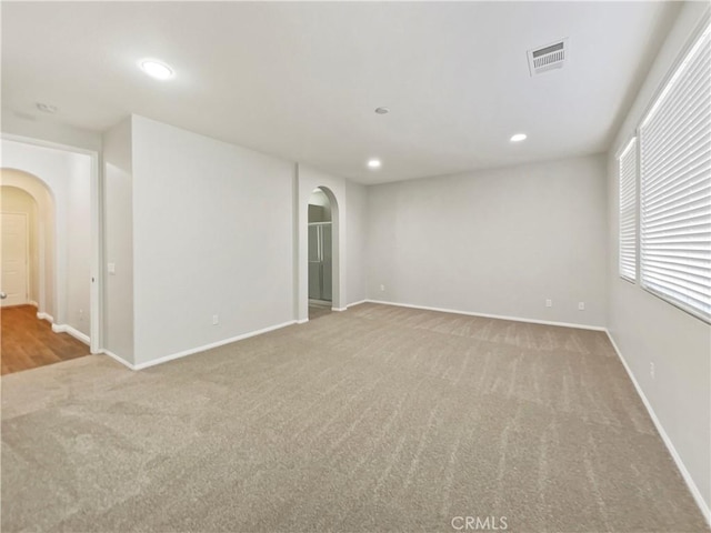 empty room with light colored carpet