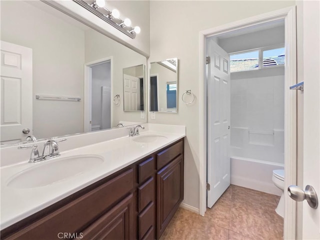 full bathroom featuring vanity, toilet, tile patterned flooring, and shower / bathing tub combination