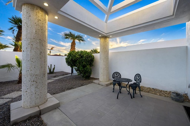 view of patio terrace at dusk