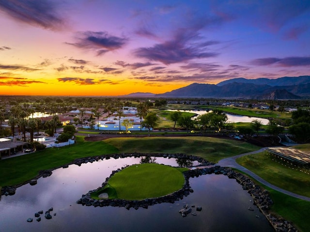 aerial view at dusk with a water and mountain view