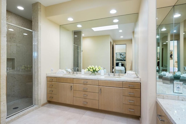 bathroom featuring vanity and an enclosed shower