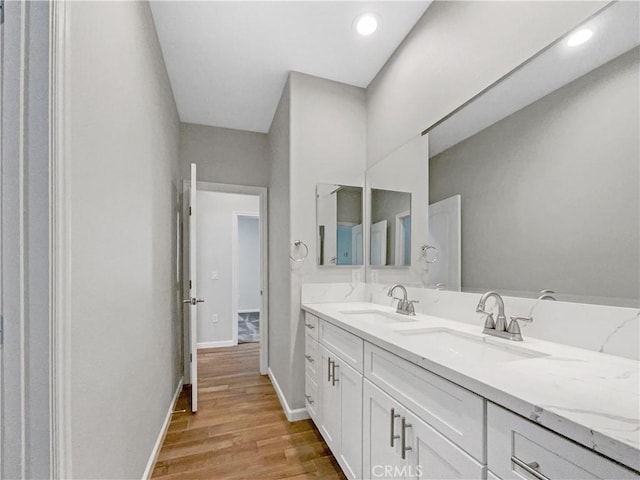 bathroom featuring vanity and hardwood / wood-style flooring