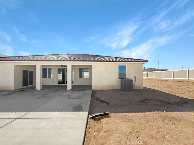 back of property featuring ceiling fan, a patio area, and central air condition unit