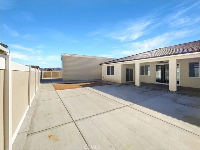 rear view of property featuring a patio