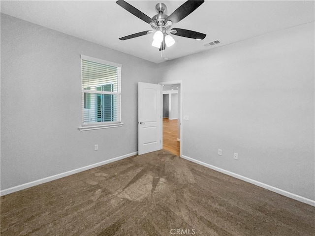 carpeted empty room with ceiling fan