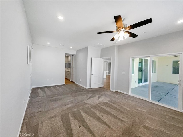 unfurnished living room featuring ceiling fan and carpet