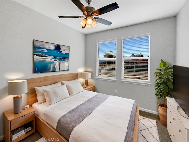 bedroom featuring ceiling fan and light colored carpet