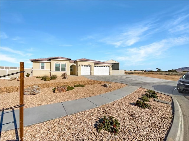 view of front of home with a garage