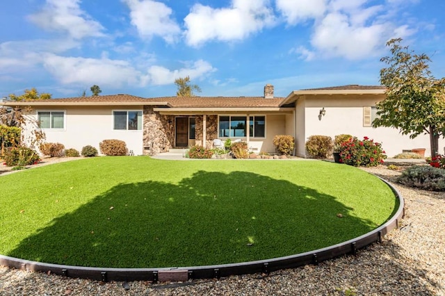 ranch-style home with a front lawn