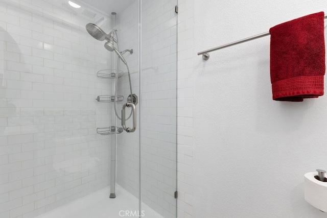 bathroom featuring an enclosed shower