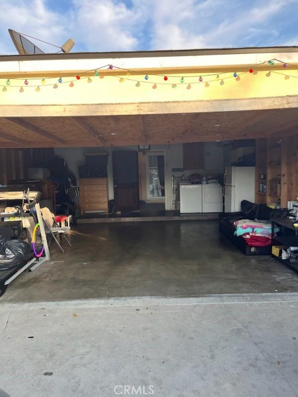 garage featuring white fridge