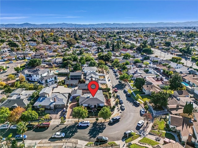 birds eye view of property with a mountain view