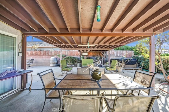 view of patio / terrace with a hot tub