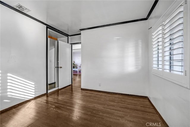 unfurnished bedroom with dark hardwood / wood-style flooring, crown molding, and multiple windows