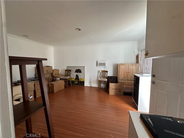 living room featuring light hardwood / wood-style flooring and ornamental molding