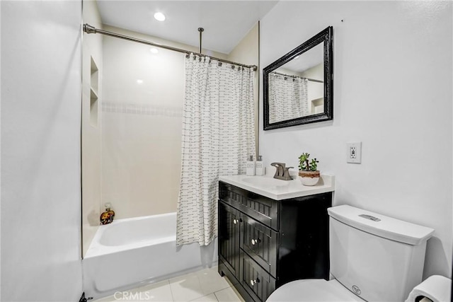 full bathroom featuring toilet, vanity, tile patterned floors, and shower / bath combo with shower curtain