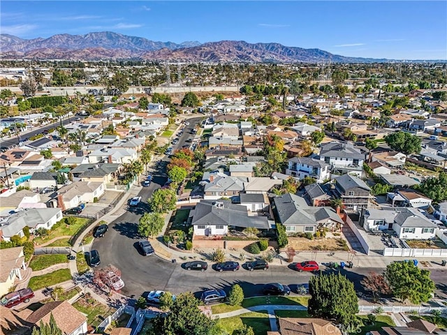 birds eye view of property with a mountain view