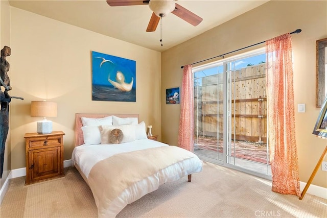 bedroom with light carpet, access to exterior, and ceiling fan