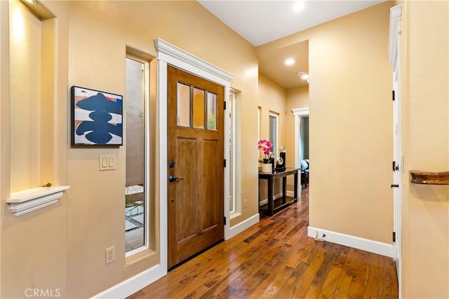 entryway with dark wood-type flooring