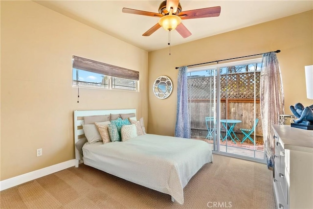 carpeted bedroom featuring ceiling fan and access to outside