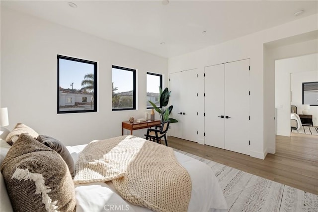 bedroom with light hardwood / wood-style flooring