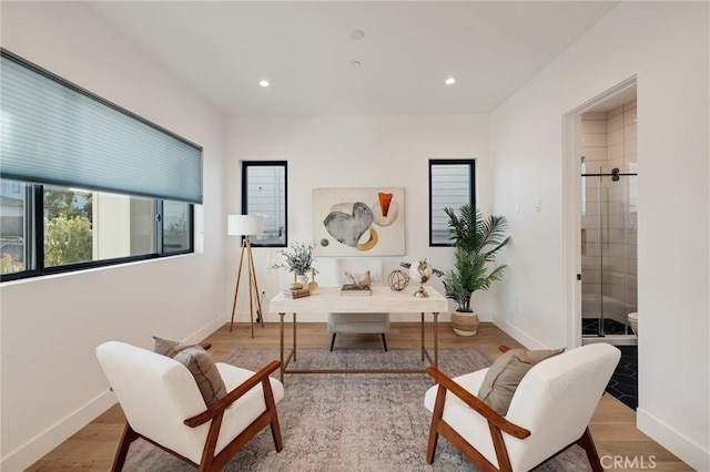 living area with light hardwood / wood-style flooring