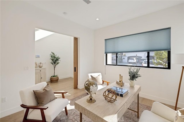 interior space featuring plenty of natural light and light hardwood / wood-style floors