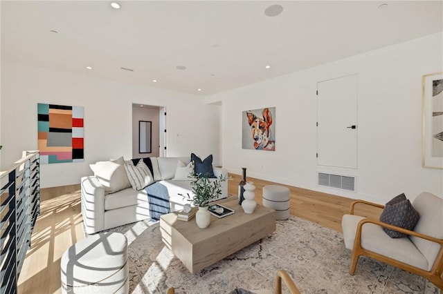 living room with light hardwood / wood-style flooring